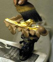 Gilding an ornamental detail